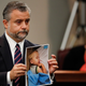 Defense attorney Maddox Kilgore with a photo of the boy. Image via AP.